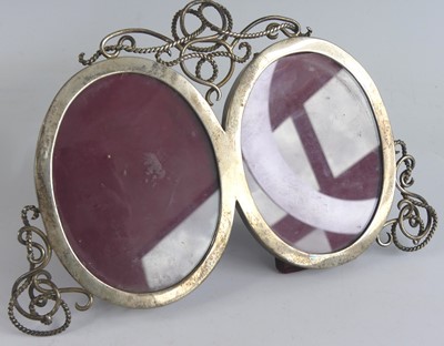 Lot 2163 - A George V silver double photograph frame, the...