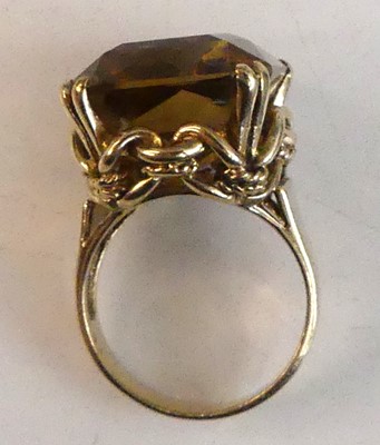 Lot 2505 - A yellow metal citrine dress ring, featuring a...