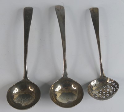 Lot 2130 - A pair of George III silver sauce ladles, in...