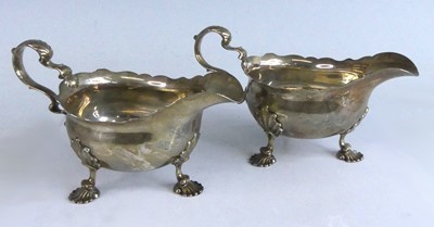 Lot 2129 - A pair of George II silver sauceboats, each of...