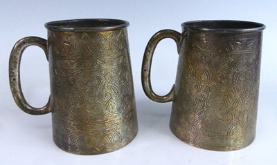 Lot 2172 - A pair of Egyptian white metal tankards, of...