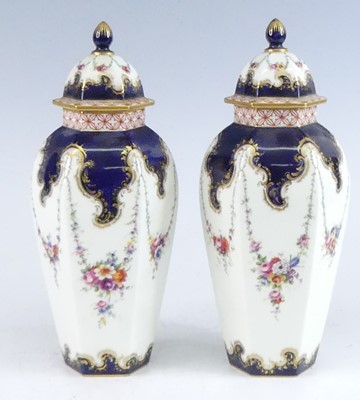 Lot 2062 - A pair of Royal Worcester vases and covers,...