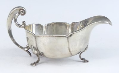 Lot 1137 - An Art Nouveau silver sauceboat, of lobed oval...