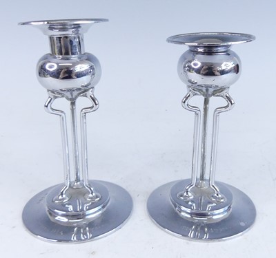 Lot 1140 - A near-pair of Art Nouveau silver candlesticks,...