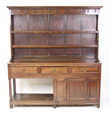 Lot 2554 - A George III joined oak dresser, the upper...