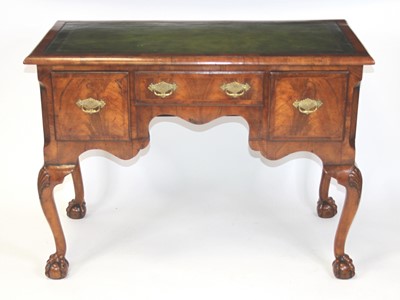 Lot 2542 - A walnut and figured walnut kneehole writing...