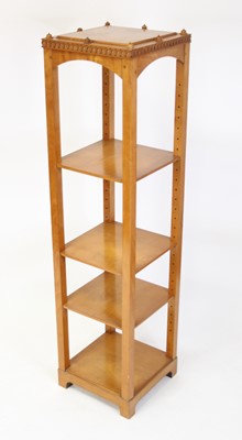 Lot 1337 - An Arts & Crafts walnut four-tier whatnot, of...