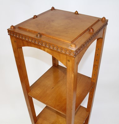 Lot 1337 - An Arts & Crafts walnut four-tier whatnot, of...