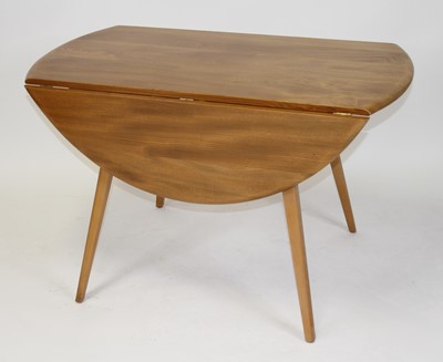 Lot 1387 - A 1960s Ercol light elm dropflap kitchen table,...