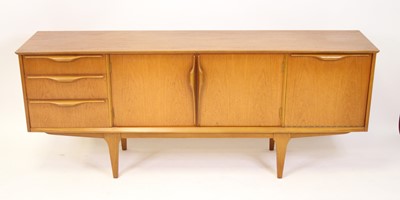 Lot 1420 - A 1970s Jentique teak sideboard, having twin...