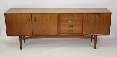 Lot 1349 - Ernest Gomme for G-Plan - a 1960s teak long...