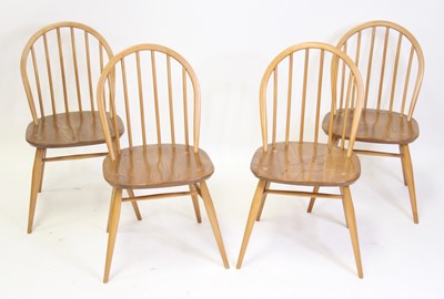 Lot 1396 - A set of four Ercol light elm stickback...