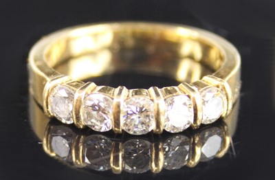 Lot 2241 - An 18ct yellow gold diamond half eternity ring,...