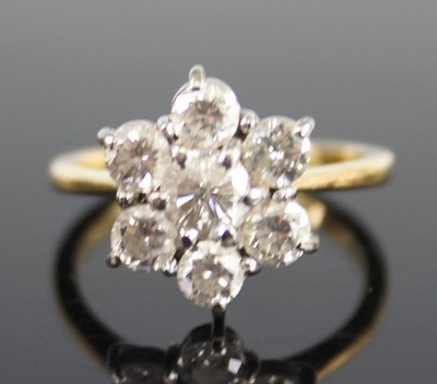 Lot 2276 - An 18ct yellow and white gold diamond flower...