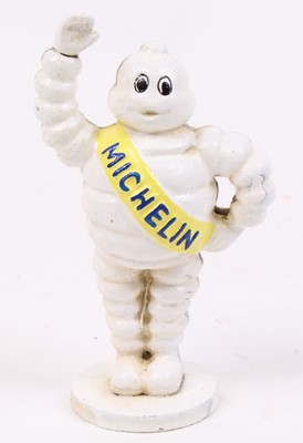 Lot 29 - A cast iron model of the Michelin Man, h.17cm