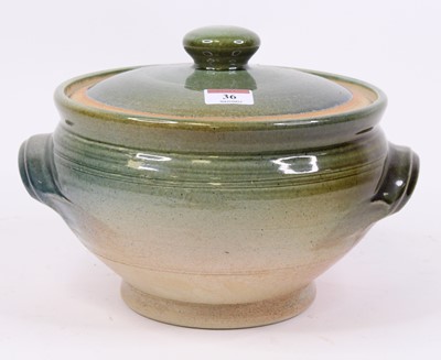 Lot 36 - A green glazed studio pottery jar and cover,...