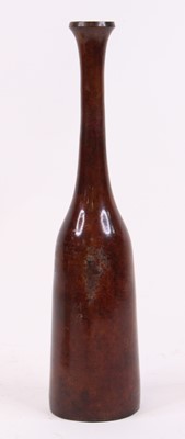 Lot 38 - A metal bottle vase, of slender form, h.35.5cm