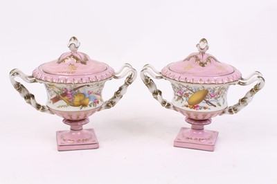 Lot 43 - A pair of Sevres style lidded urns, each...