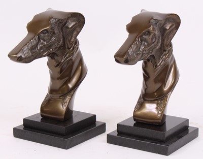 Lot 52 - A pair of cast metal models of greyhounds,...
