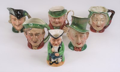 Lot 99 - A collection of five character jugs, together...