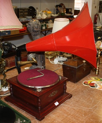Lot 128 - A reproduction gramophone, having a large red...