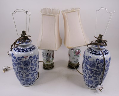 Lot 135 - A pair of Chinese blue and white table lamps,...