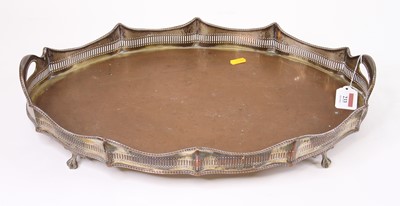 Lot 233 - An Edwardian silver plated tray, of twin...