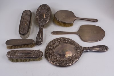 Lot 254 - A George VI silver-clad brush set, with engine...