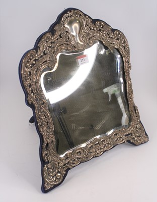 Lot 272 - An Edwardian silver clad dressing table mirror,...