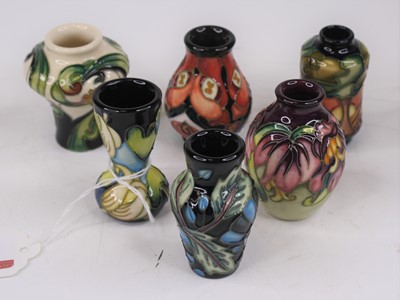 Lot 192 - A set of six Moorcroft miniature vases, each...