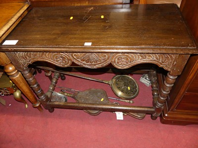 Lot 1309 - A joined and relief carved oak bobbin turned...