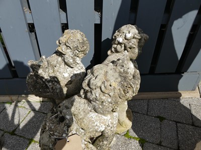 Lot 1528 - A set of three concrete cherub standing...