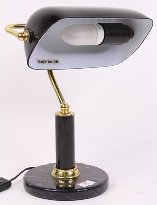 Lot 62 - A brass adjustable desk lamp, having a black...