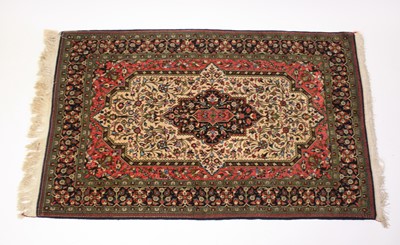 Lot 2545 - A Persian woollen fineweave Tabriz rug, having...