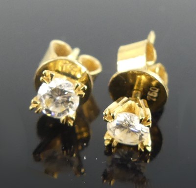 Lot 2229 - A pair of yellow metal diamond single stone...