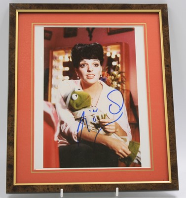 Lot 186 - Liza Minelli, a 25 x 20cm colour photograph of...