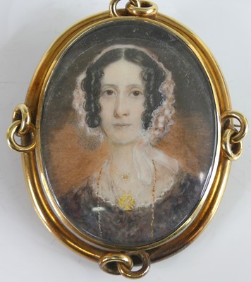 Lot 2220 - A Victorian miniature portrait mourning brooch,...