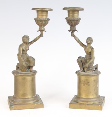 Lot 2344 - A pair of Victorian brass figural candle...