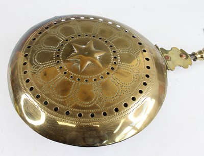 Lot 2342 - A late 17th century brass and iron warming pan,...