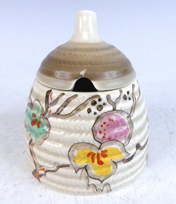 Lot 1040 - A 1930s Clarice Cliff honey pot and...