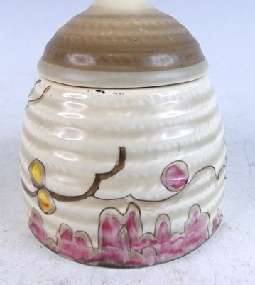 Lot 1040 - A 1930s Clarice Cliff honey pot and cover,...