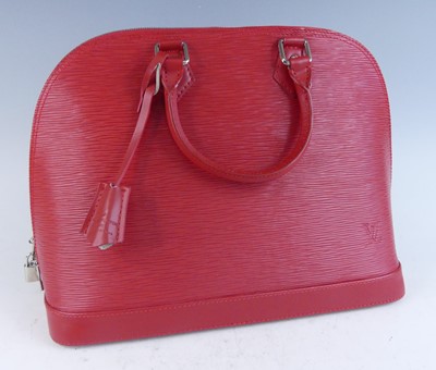 Lot 1181 - Louis Vuitton - a Vernis red leather Alma...