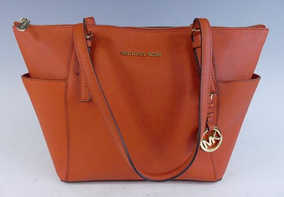 Lot 1177 - Michael Kors - a Jet Set leather tote bag,...