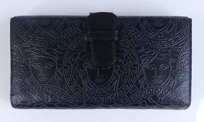 Lot 1175 - Gianni Versace - a gent's leather wallet, the...