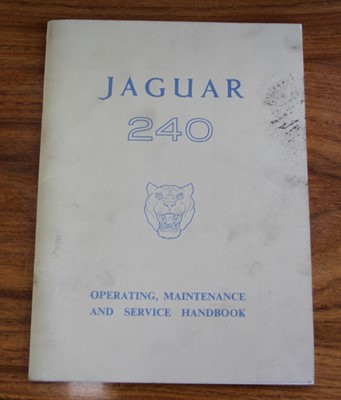 Lot 3013 - A Jaguar 240 maintenance chart, mounted under...