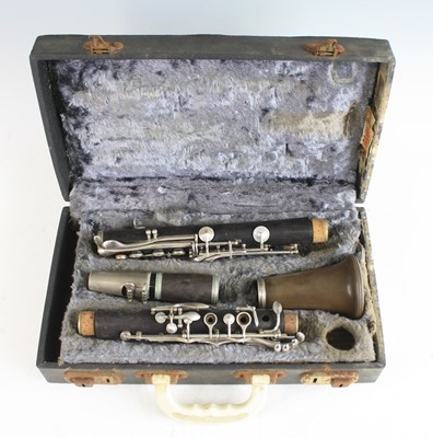 Lot 254 - A Boosey and Hawkes "77" four piece clarinet,...