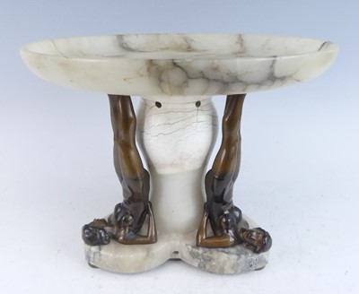 Lot 1215 - An Art Deco patinated spelter and alabaster...