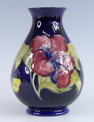 Lot 1023 - A Moorcroft Hibiscus pattern pottery vase, of...