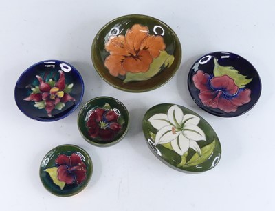 Lot 1025 - A collection of six Moorcroft pottery items,...