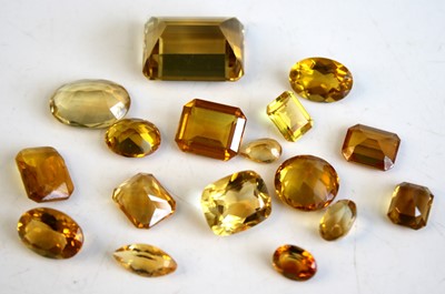 Lot 2523 - A collection of loose vari-cut citrine stones,...